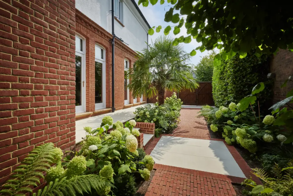 Planting against architecture in a completed Refined garden