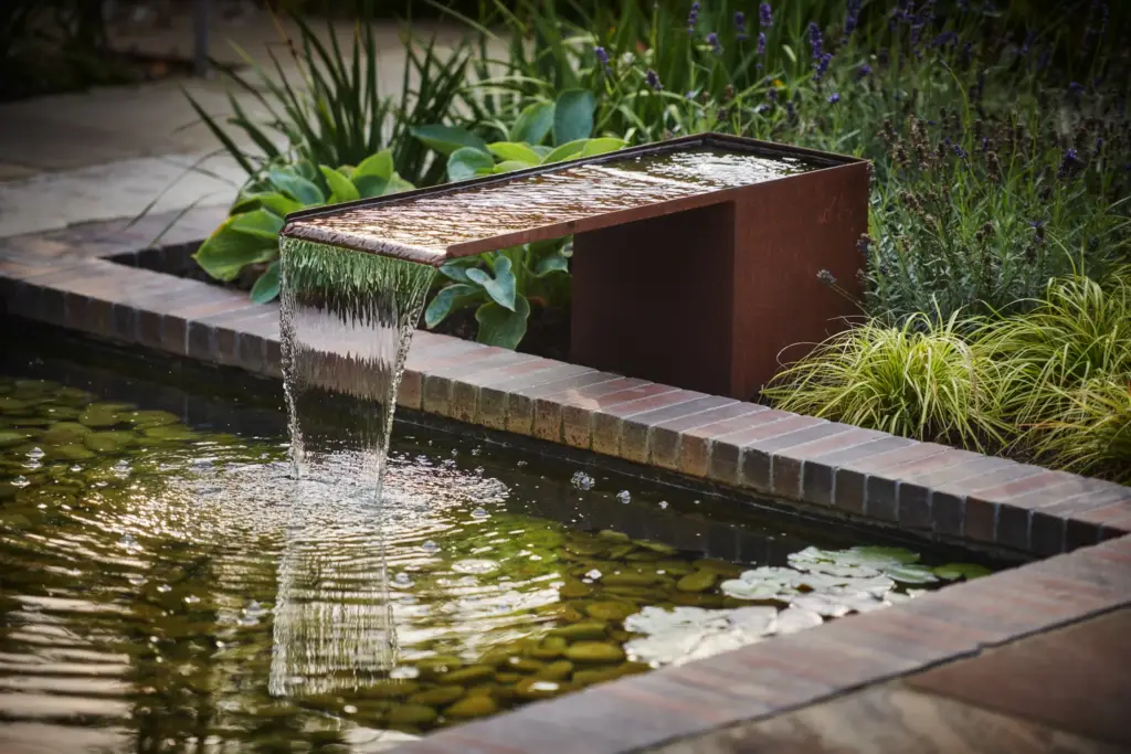 Layered planting detail in a completed Refined garden