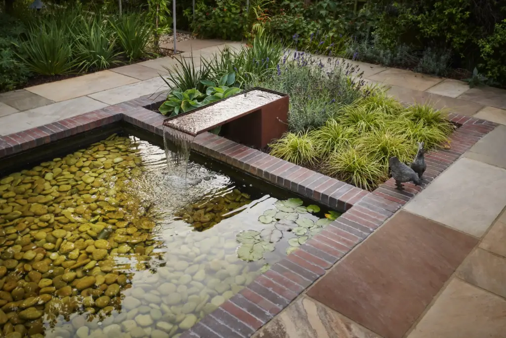 Corten steel water feature detail in a Refined garden