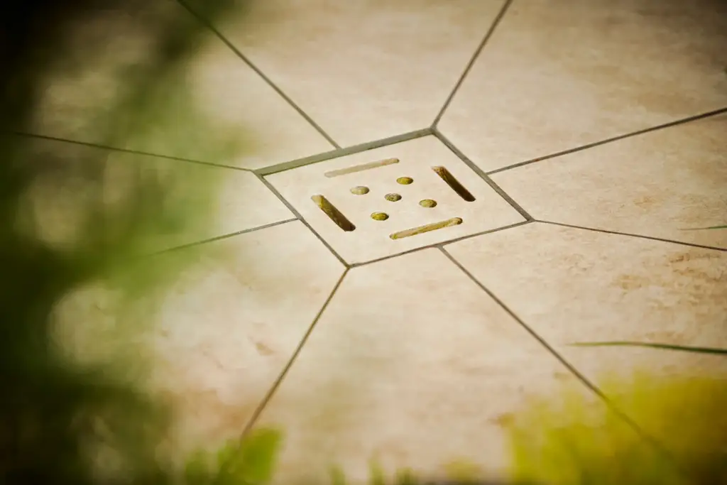 Precision stone drainage detail with radial paving pattern