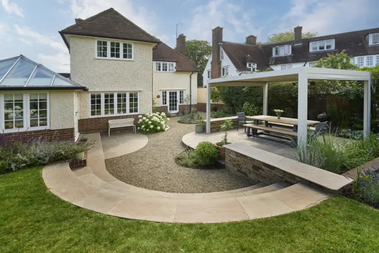 Outdoor kitchen and dining terrace in a Refined Landscapes garden