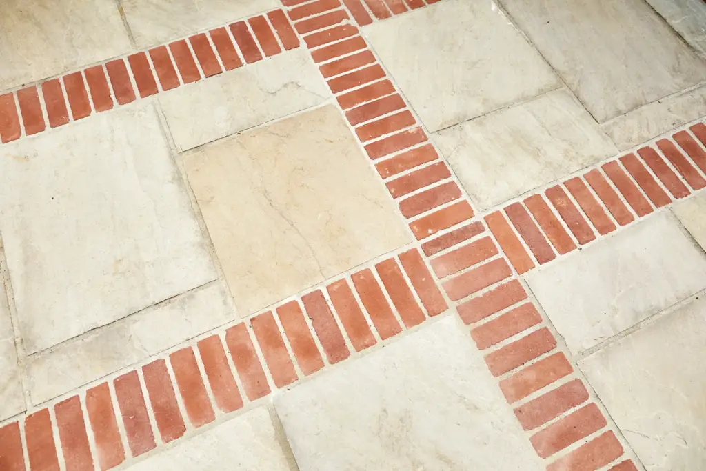 Sandstone paving with clay brick banding
