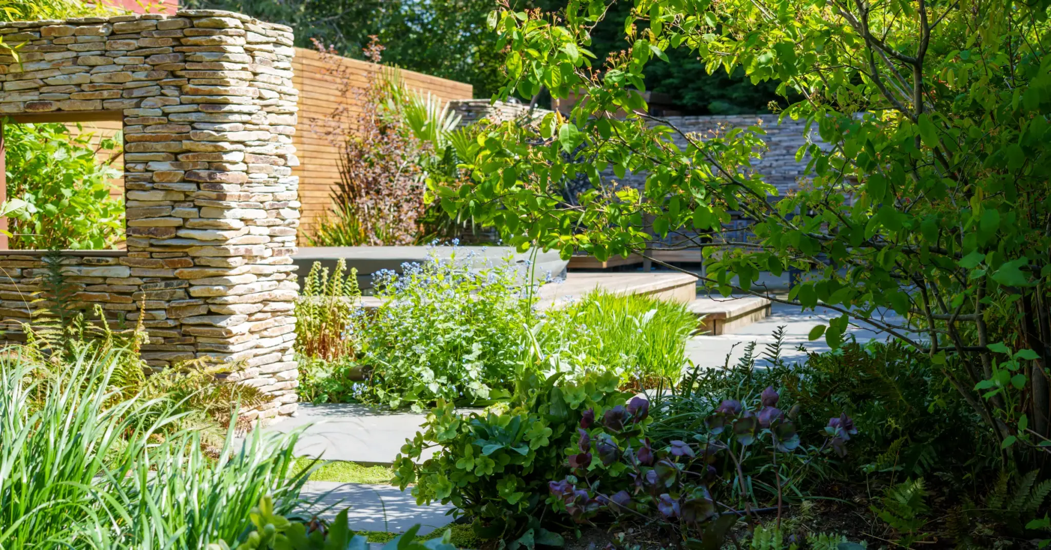 Full-width photograph of a completed Refined Landscapes garden