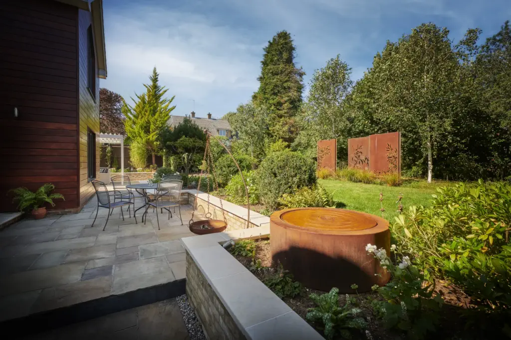 Harvest sawn London Stone paving with yellow brickwork and Corten features