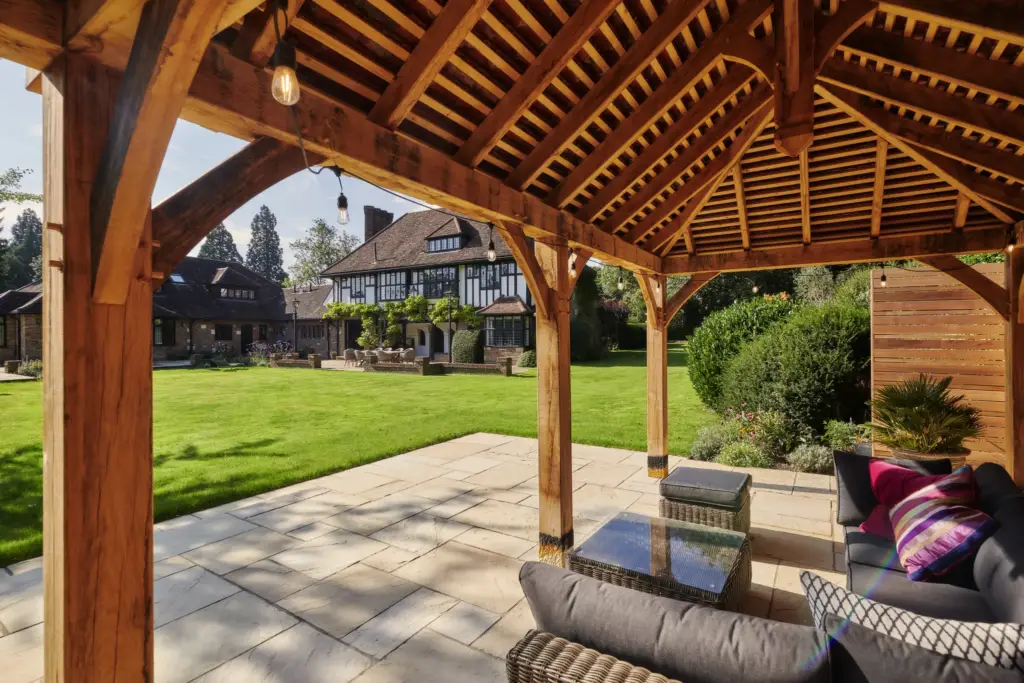 Seating beneath the oak gazebo looking back to the house