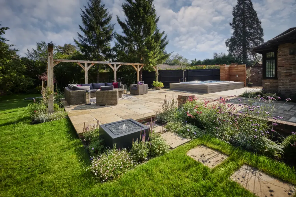 Sunken swim spa deck and pergola seating beside the terrace