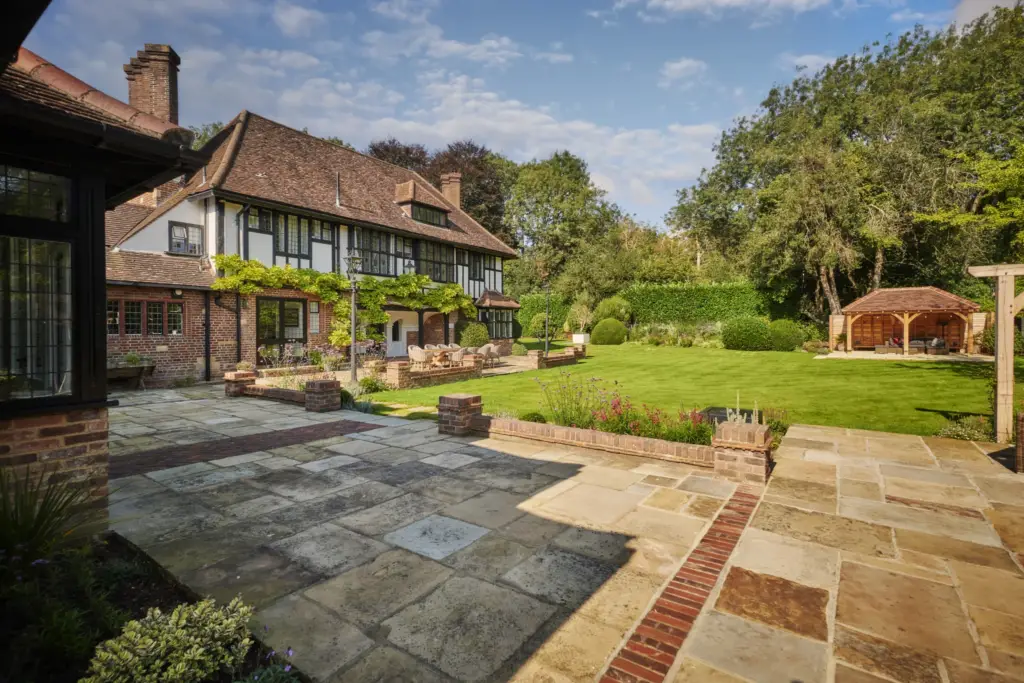 Reclaimed York stone terrace and steps beside the house