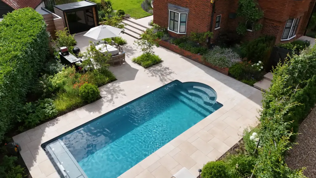 The Poolside Garden from the air after completion: the pool, terrace and garden room as built