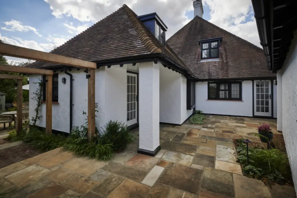The Yorkstone Garden - refined stone terrace and planting by Refined Landscapes