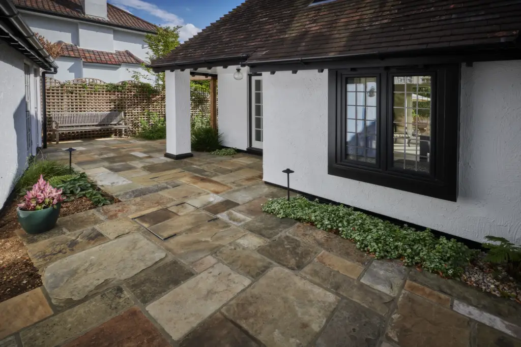 Yorkstone garden design in Hertfordshire with structured planting